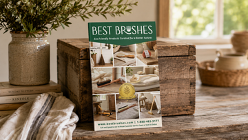 Best Brushes 2026 catalog displayed beside folded towels, a natural-bristle brush, and a ceramic vase