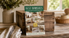 Best Brushes 2026 catalog displayed beside folded towels, a natural-bristle brush, and a ceramic vase